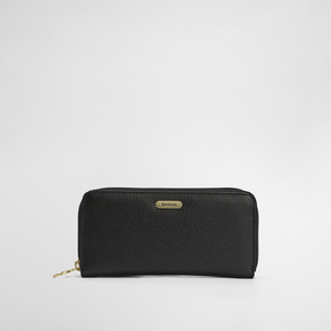 Lompakon etupuolella on pieni tyylikäs metallinen logolaatta.