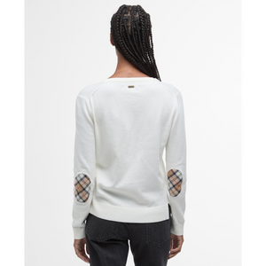 Neuletakin niskassa on pieni metallinen Barbout -logolaatta.