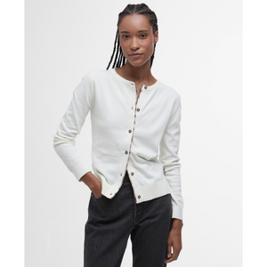 Monikäyttöinen neuletakki sopii hyvin sekä housujen että hameen seuraksi.