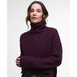 Neuleessa on reilunkokoiset resorit hihansuissa, kauluksessa ja vyötäröllä.