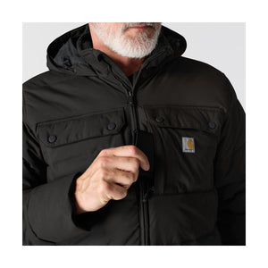 Takissa on nepparikiinnitteiset rintataskut ja vasemmalla myös vetoketjulla suljettava piilotasku.