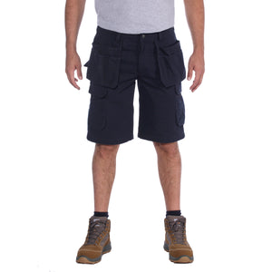 Kuvassa miehellä on päällä Carhartt Steel Multipocket shortsit jotka on värissä navy.