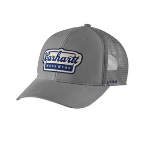 Kuvassa on harmaa Carhartt Script Patch Cap trucker -mallinen lippis jossa on verkkomainen takaosa ja edessä näyttävä Carhartt Workwear -brodeeraus.