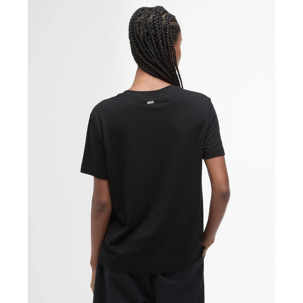 Paidan selkäpuolella on pieni metallinen logolaatta.