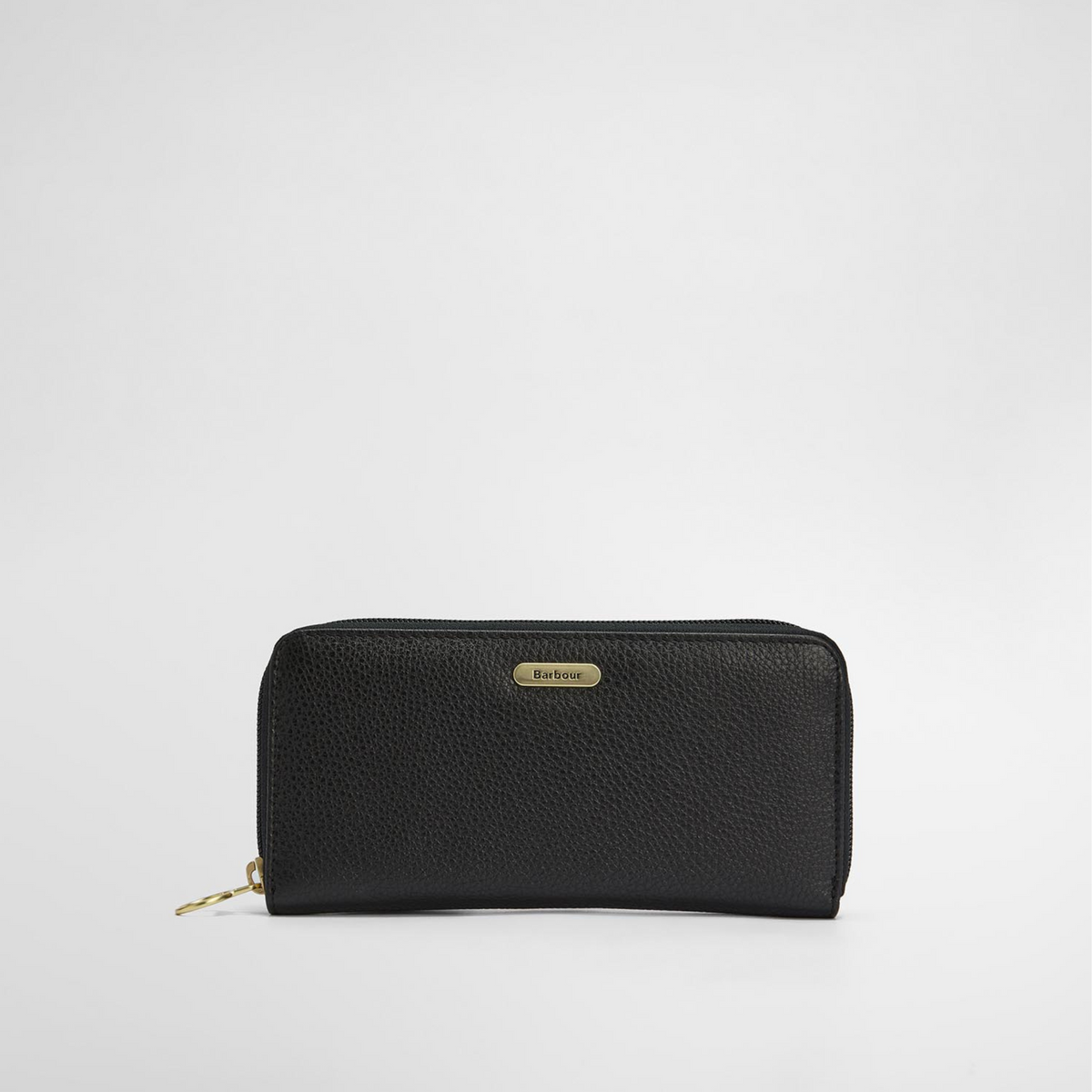 Lompakon etupuolella on pieni tyylikäs metallinen logolaatta.