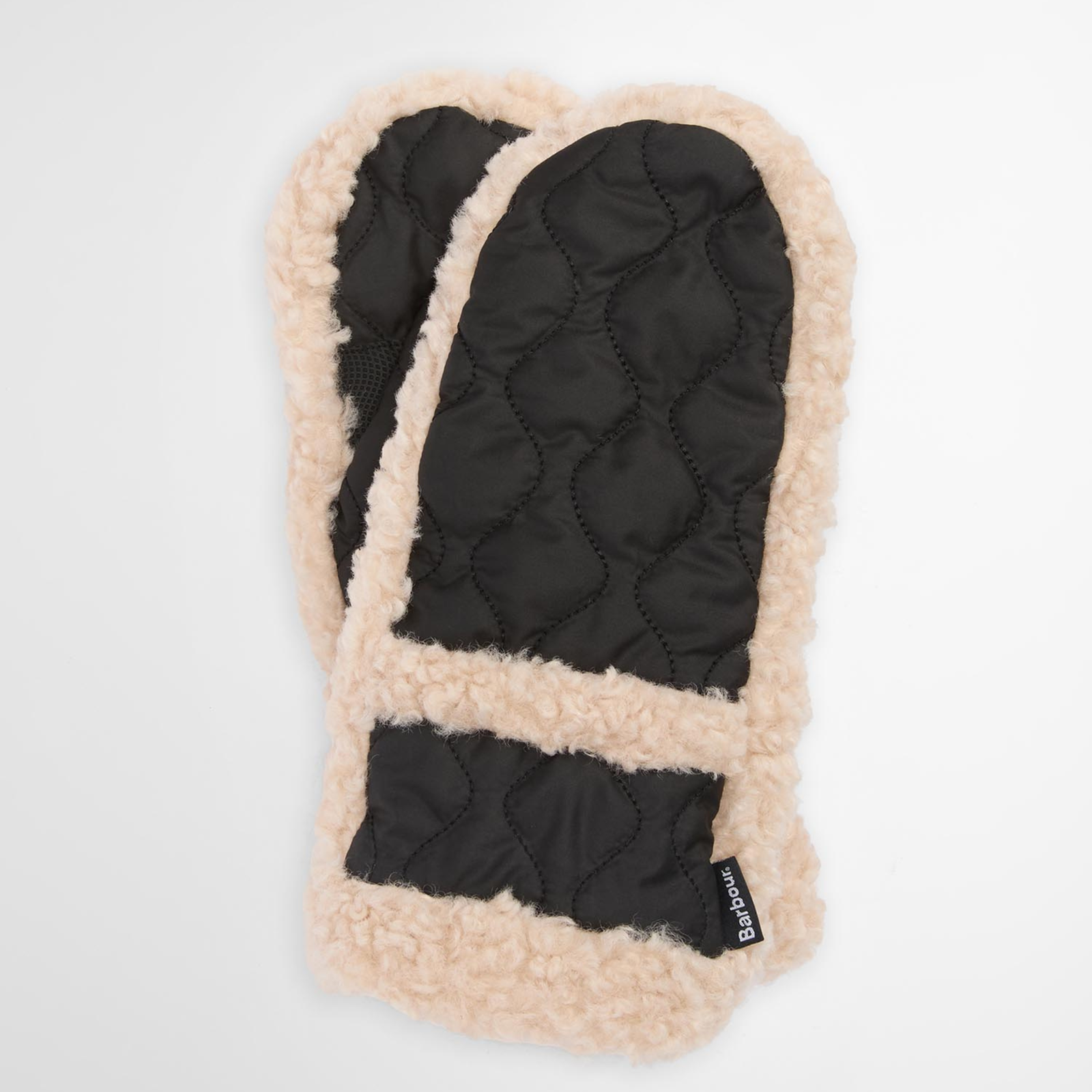 Vedenpitävissä lapasissa on sipulitikkikuviointi ja tekoturkisreunukset.