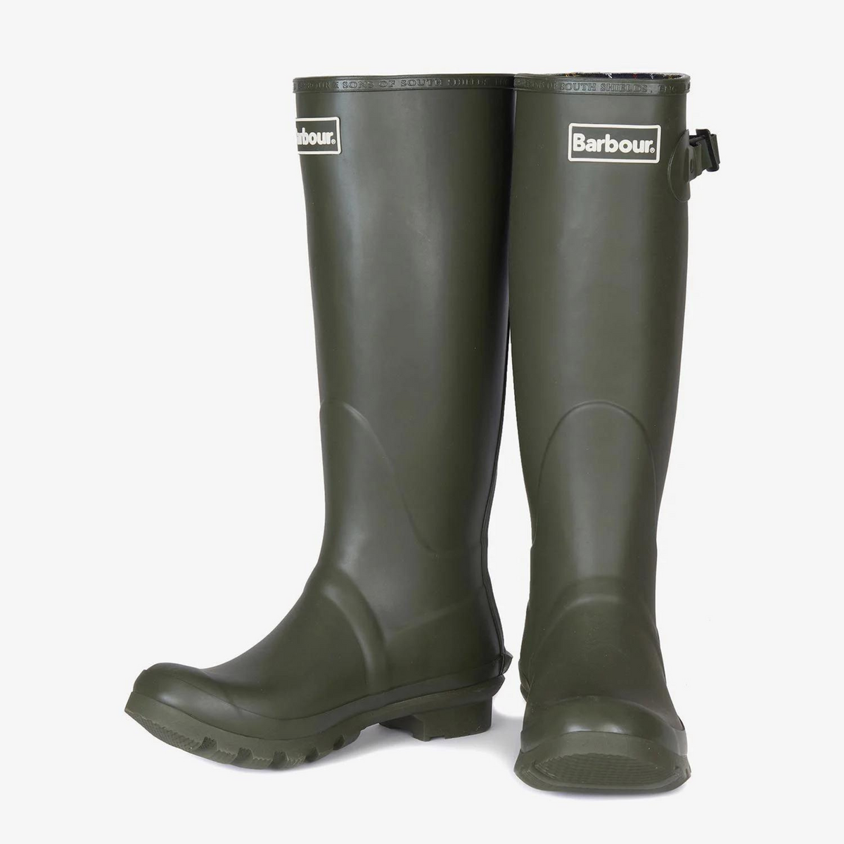 Saappaiden yläreunassa on valkoinen Barbour-logo.