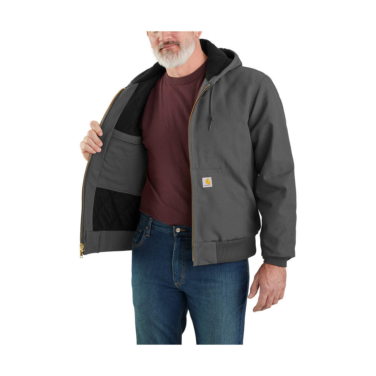 Miehellä on kuvassa käytössä Carhartt Icon J140 Active Jacket takki jossa on sisällä pieni tasku.