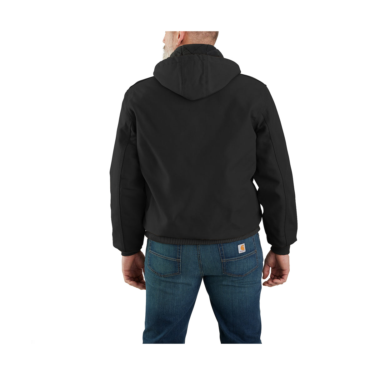 Takaapäin kuvattuna miehen päällä on musta Carhartt Icon J140 Active Jacket takki jossa on huppu.