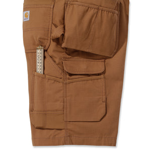 Sivusta kuvattuan Carhartt Steel Multipocket shortsit jossa on reidessä taskut työkaluille.