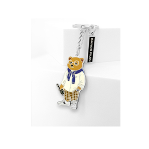 Kuvassa on Baron Filou avaimenperä jossa on nallella pullo kädessä. 