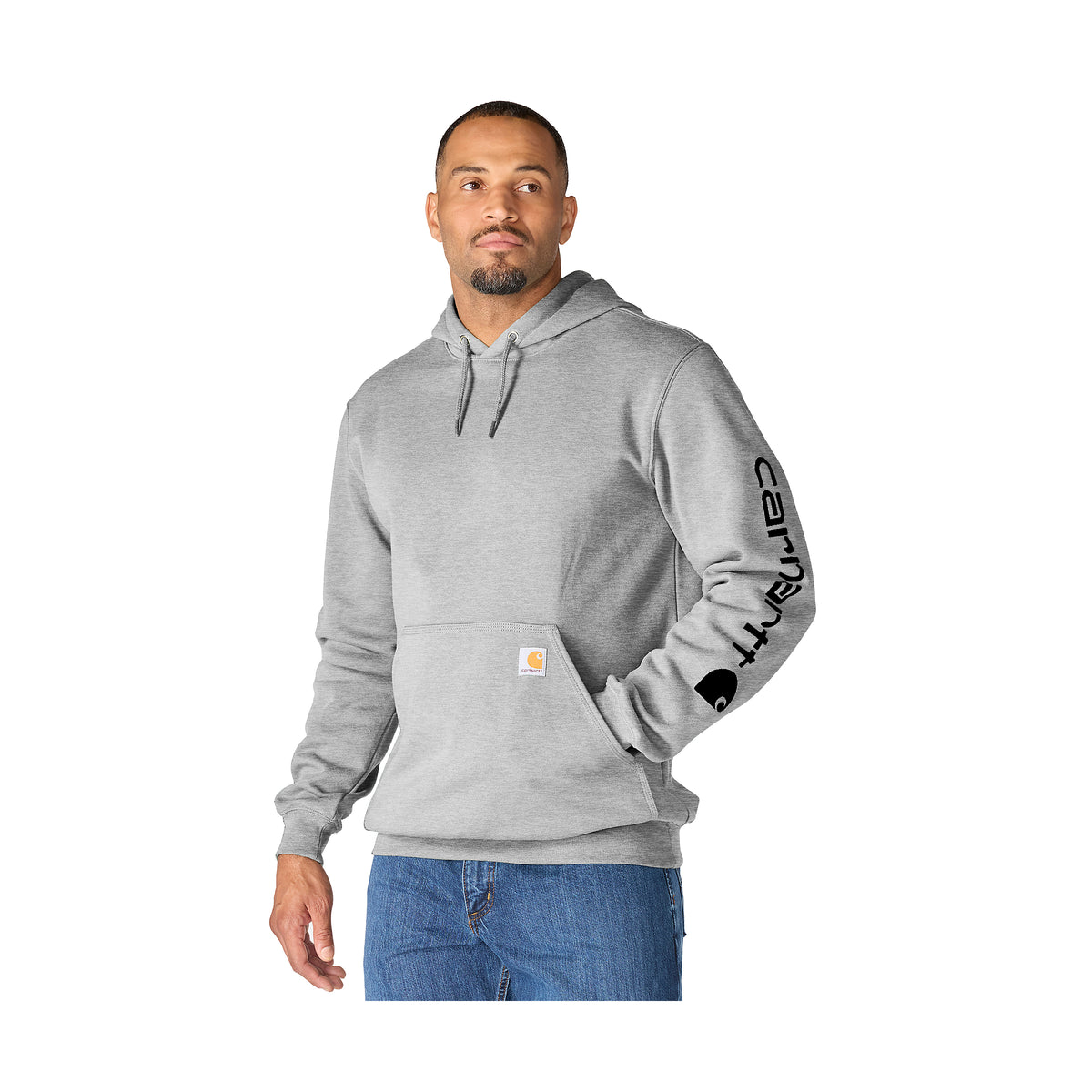 Vaaleanharmaa Carhartt K288 huppari miesmallin päällä.