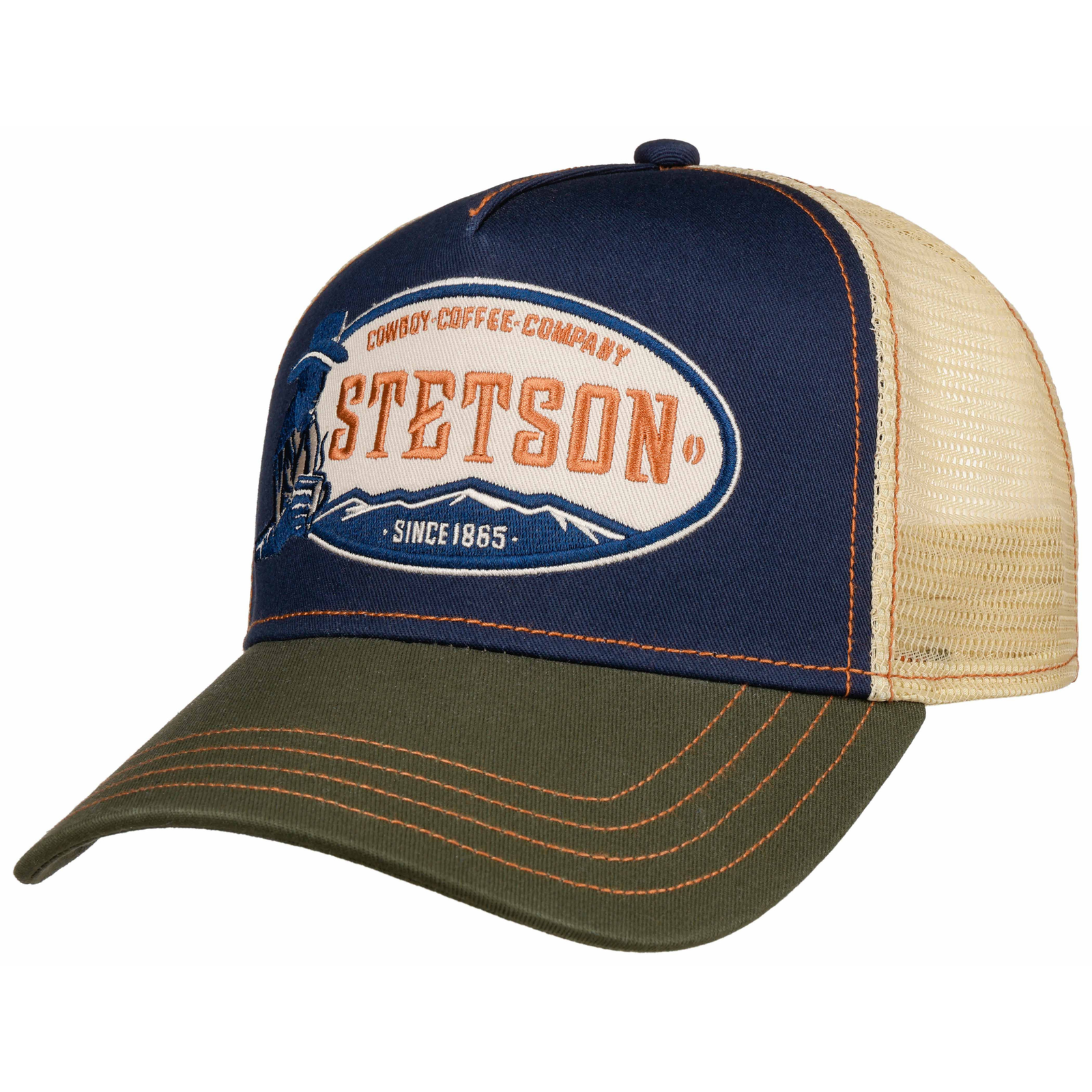 Stetson Cowboy Coffee trucker capissa on vihreä lippa, sininen hattuosa, jossa näyttävä brodeeraus. Takana oleva verkkovuori on vaalean beige.